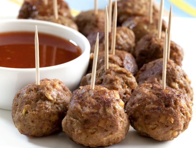 Meatball appetizers, with a dipping sauce.