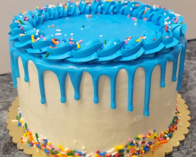 blue and white drip birthday cake