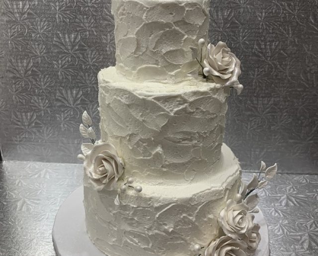 textured white tiered wedding cake