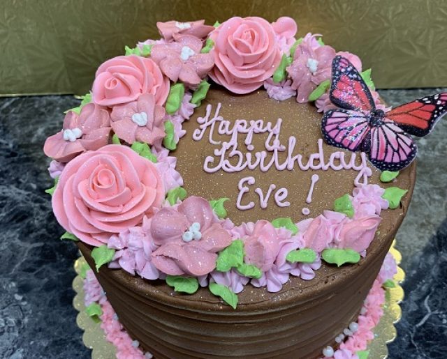 round layered flower and butterfly birthday cake